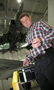 At the Imperial War Museum hangar in Duxford, UK, Scott Probasco, a Nokia senior manager, shows how a Nokia smartphone can connect to the Internet via TV white spaces and use an app to grab information about the planes on display. Image: Courtesy of Nokia